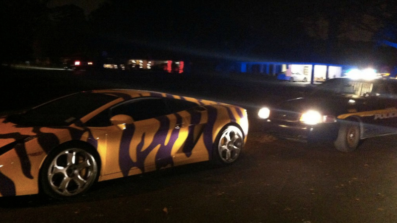 Illustration for article titled This LSU-Striped Lamborghini Was Pulled Over For Breaking Laws Of Good Taste